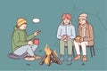 Young people communicate while sitting around campfire during camping trip in nature. Vector image Royalty Free Stock Photo