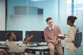 Young People Communicating in Office Royalty Free Stock Photo