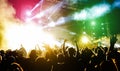 Young people dancing and having fun in summer festival party outdoor - Crowd with hands up celebrating fest concert event - Soft Royalty Free Stock Photo