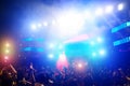 Young people dancing and having fun in summer festival party outdoor - Crowd with hands up and smarphones celebrating fest concert Royalty Free Stock Photo