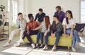 Young people diverse group portrait, happy friends sitting on sofa talking, chatting Royalty Free Stock Photo