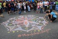 Young people drawing mandala for love and peace in the streets of Caracas during Venezuela blackout