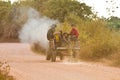 Young people driving a tractor