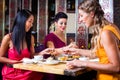 Young people eating sushi in restaurant Royalty Free Stock Photo