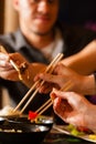 Young people eating in Thai restaurant