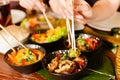 Young people eating in Thai restaurant