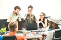 Young people employees group workers with computer in startup office