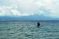 Young people enjoy riding on tiny small boat on sea