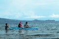 Young people enjoy riding on tiny small boat on sea