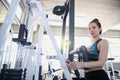 Young people exercising in the gym. asian body builder working out in gym using fitness straps in the gym center Royalty Free Stock Photo