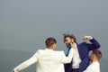 Young people fighting in nature on blue sky background Royalty Free Stock Photo