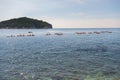 Young people are floating in a sea kayaks. Water-based activities in Dubrovnik Bay, Adriatic Sea