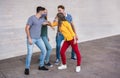 Young people friends bump their elbows instead of greeting with a hug - Avoid the spread of coronavirus, social distance and