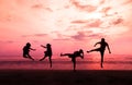 Young people are jumping on the beach at sunset in Thailand, Mae nam beach, Bo Phut, Samui Royalty Free Stock Photo