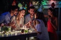 Young people with funny hats at a birthday party