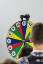 Young people gamble on the Wheel of Fortune