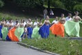 Young people going to a stage to dance waltz. Costume ball of high-school graduates