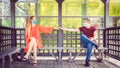 Young people dating while keeping social distance to avoid spread of covid-19 virus