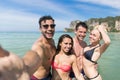 Young People Group On Beach Summer Vacation, Happy Smiling Friends Taking Selfie Photo In Water Sea Ocean Royalty Free Stock Photo