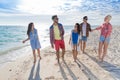 Young People Group On Beach Summer Vacation, Happy Smiling Friends Walking Seaside Royalty Free Stock Photo