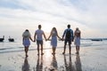 Young People Group On Beach At Sunset Summer Vacation, Friends Walking Seaside Back Rear View Royalty Free Stock Photo