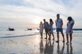 Young People Group On Beach At Sunset Summer Vacation, Friends Walking Seaside Royalty Free Stock Photo