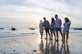 Young People Group On Beach At Sunset Summer Vacation, Friends Walking Seaside Royalty Free Stock Photo