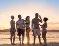 Young People Group On Beach At Sunset Summer Vacation, Happy Smiling Friends Walking Seaside Royalty Free Stock Photo