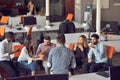 Young people group in modern office have team meeting and brainstorming while working on laptop and drinking coffee Royalty Free Stock Photo