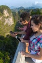 Young People Group In Mountain Using Cell Smart Phone Chatting Online Friends Asian Holiday Summer Royalty Free Stock Photo