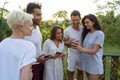 Young People Group On Terrace Tropical Hotel, Friends Using Cell Smart Phone Tropic Holiday Vacation Royalty Free Stock Photo