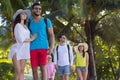 Young People Group Tropical Park Palm Trees Friends Walking Speaking Holiday Summer Vacation Royalty Free Stock Photo