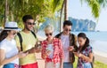 Young People Group Using Cell Smart Phones Tropical Park Palm Trees Friends Chatting Online Holiday Sea Summer Vacation Royalty Free Stock Photo