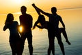 Young people, guys and girls, students are dancing couples at sunset background Royalty Free Stock Photo