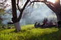 Young people having barbecue out in the garden