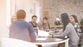 Young people having business meeting in conference room, view through glass Royalty Free Stock Photo