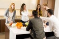 Young people having dinner and drinking wine in modern Royalty Free Stock Photo