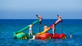 Young people having fun on aquatic cars in Mallorca, Spain