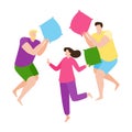 Young people having fun at a pajama sleepover party. Two guys and a girl fight with pillows. Colorful concept for pajama party or Royalty Free Stock Photo