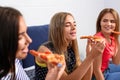 Young people having fun at party with delicious pizza indoors Royalty Free Stock Photo