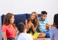 Young people having fun at party with delicious pizza indoors Royalty Free Stock Photo