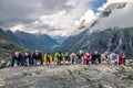 Young people are having fun on the top of mountain, Trollstigen, Norway