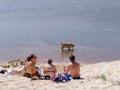 Young People Having a Picnic on the Beach