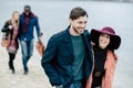 Young people having stroll on beach Royalty Free Stock Photo