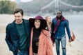 Young people having stroll on beach Royalty Free Stock Photo