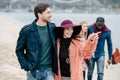 Young people having stroll on beach Royalty Free Stock Photo