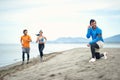 Young people having training on the beach Royalty Free Stock Photo