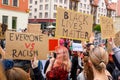 Young people hold a poster with words `Black lives matter` on polish peaceful