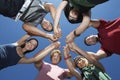 Young People Holding Hands In Circle