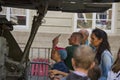 Young people inspect the destroyed armored vehicles